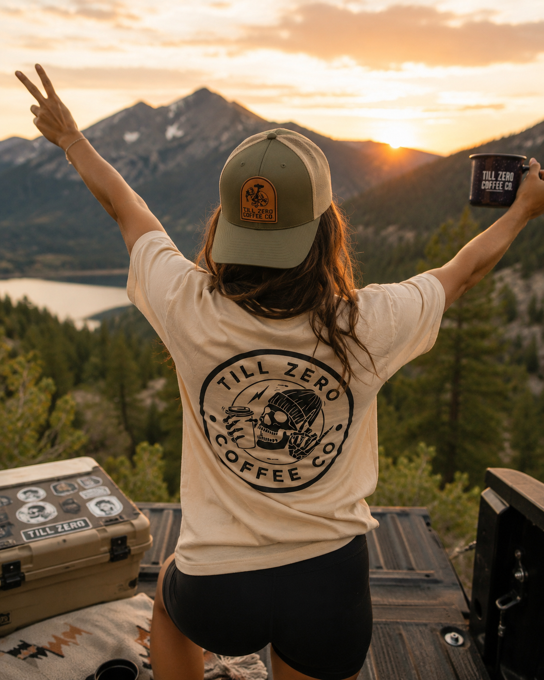 Till Zero Coffee Co. tee in cream worn with the TZCO trucker cap, outdoors